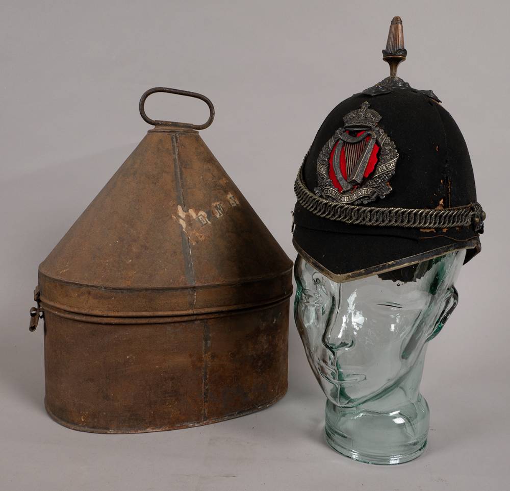 1902 pattern Royal Irish Constabulary helmet with its metal hatbox. at Whyte's Auctions