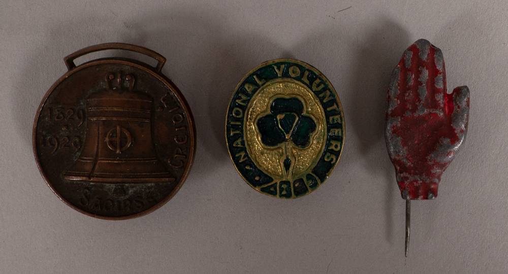 1912-1929 badges including Red Hand of Ulster, National Volunteers, and Centenary of Catholic Emancipation. (3) at Whyte's Auctions